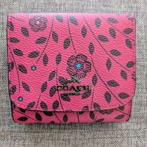Pink Coach wallet with flowers
